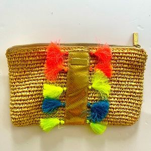Lily Pulitzer straw clutch with bright neon pom poms. Unique and versatile.